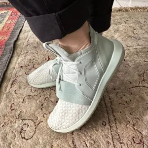 Adidas Tubular mint green sneakers.