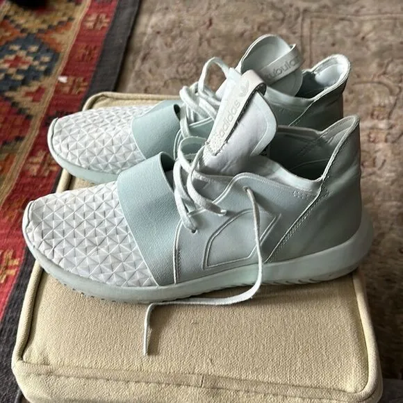 Adidas Tubular mint green sneakers.